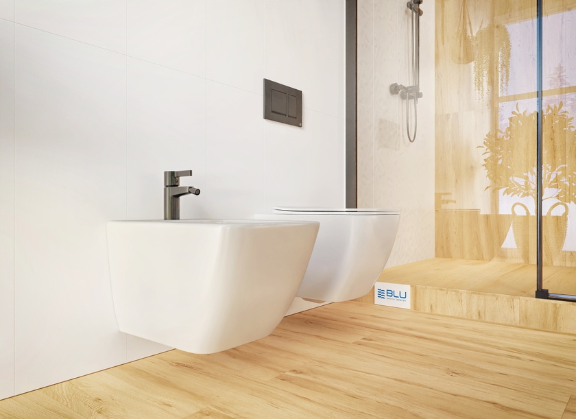 Bidet i miska WC IÖ Arnoy w białej łazience z imitacją drewna